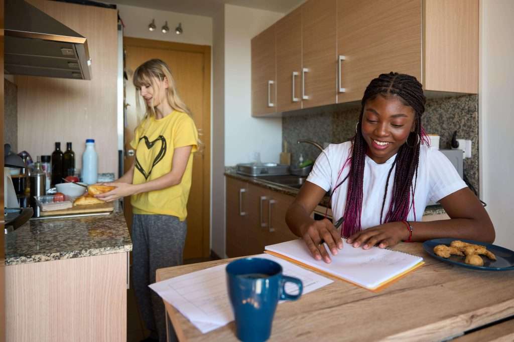 multiethnic-students-sharing-apartment-and-studyin-2025-03-09-15-04-12-utc-min